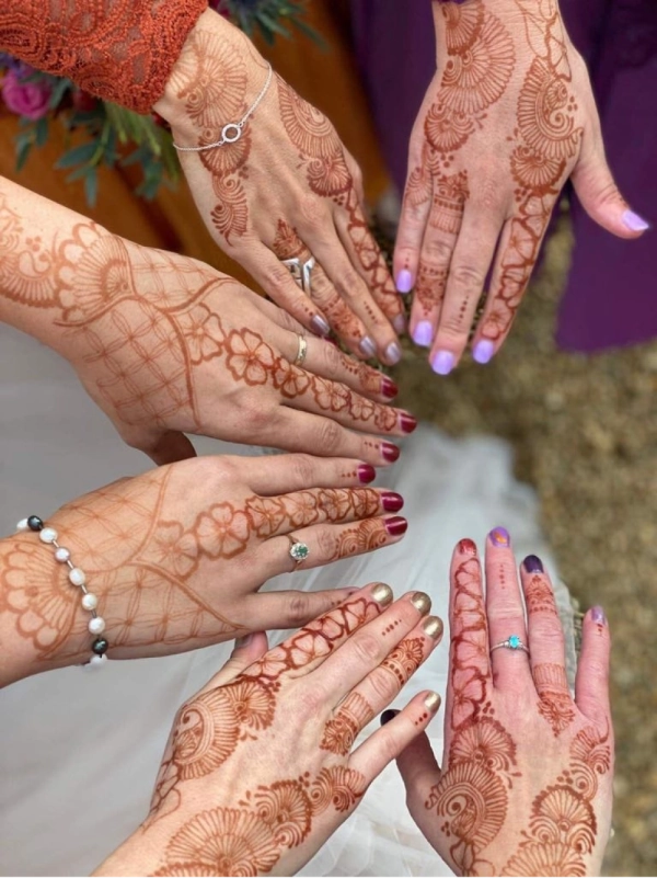 Bridal party with henna on their hands