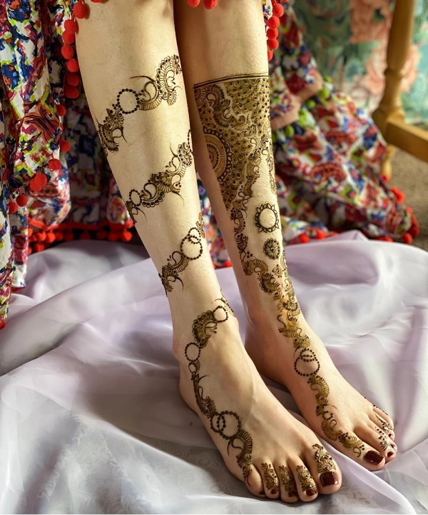 Female legs with bridal henna